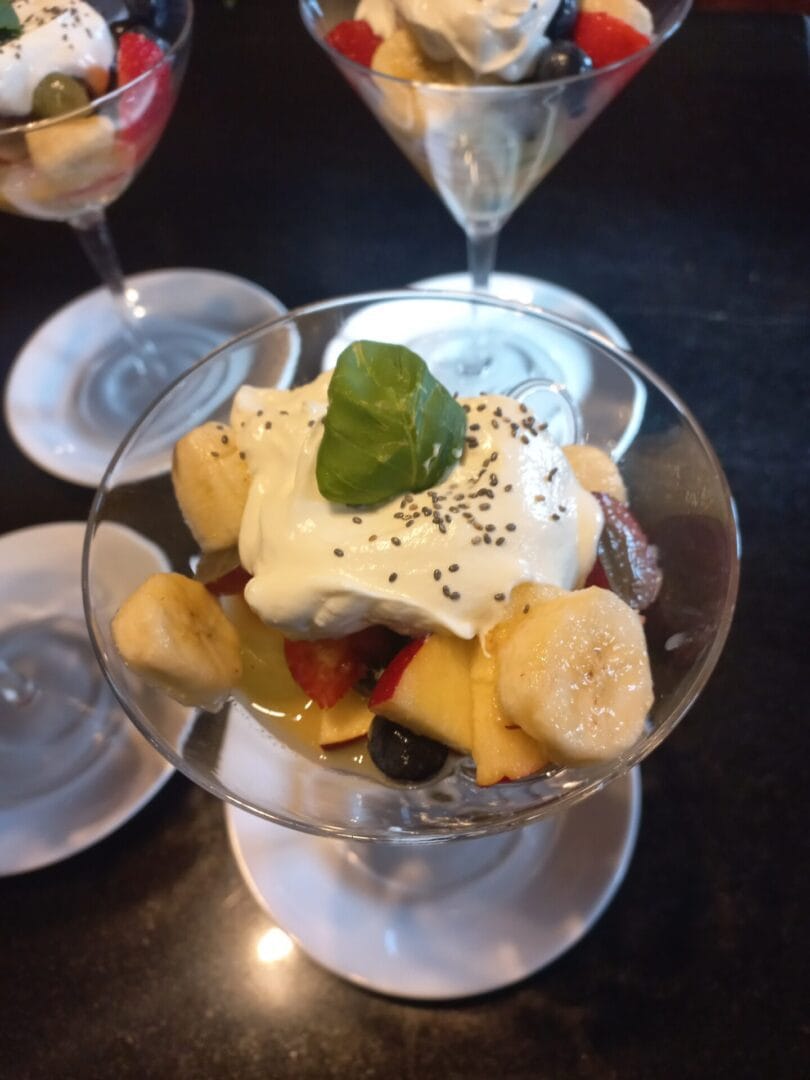 Breakfast table set at An Riasc B&B in Dingle, with juice, cups, and mountain view